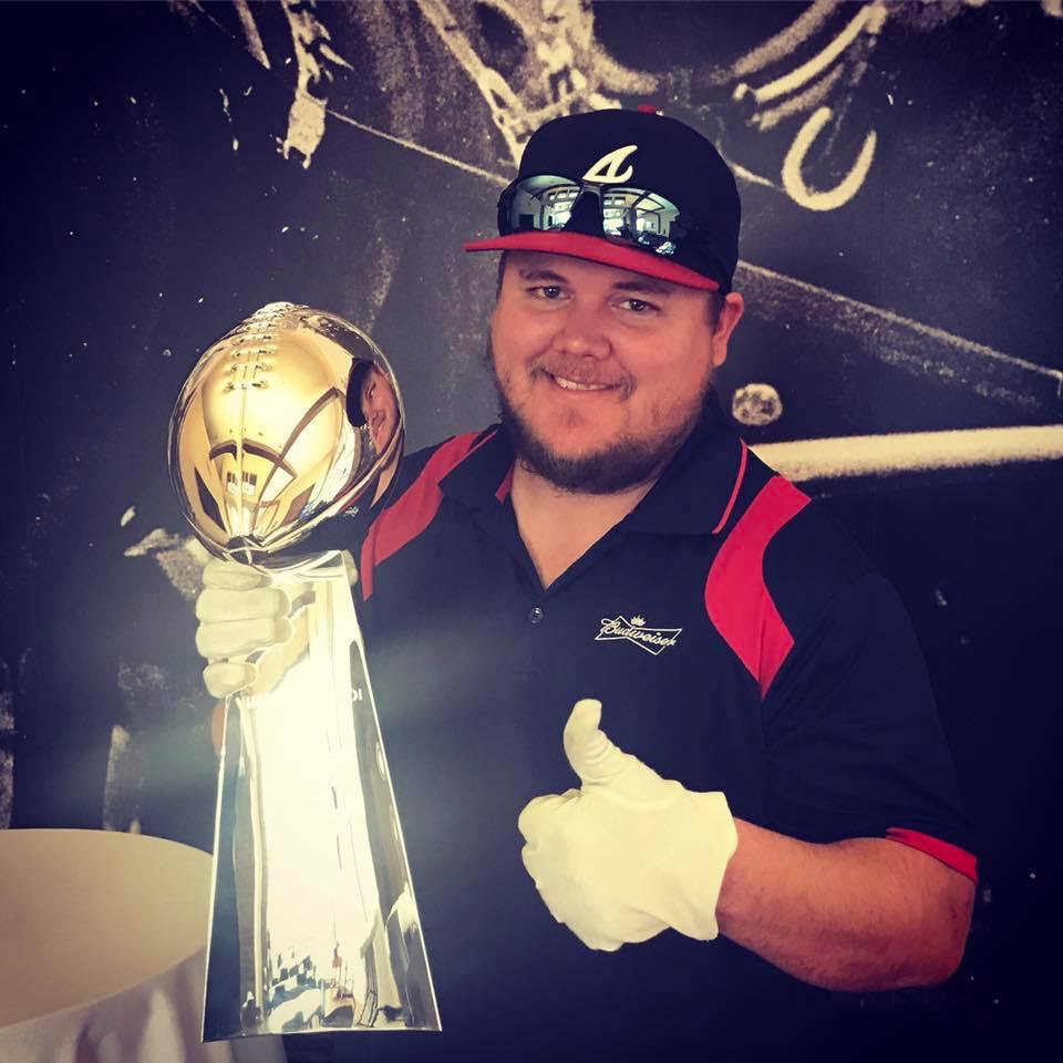 Holding the Lombardi trophy